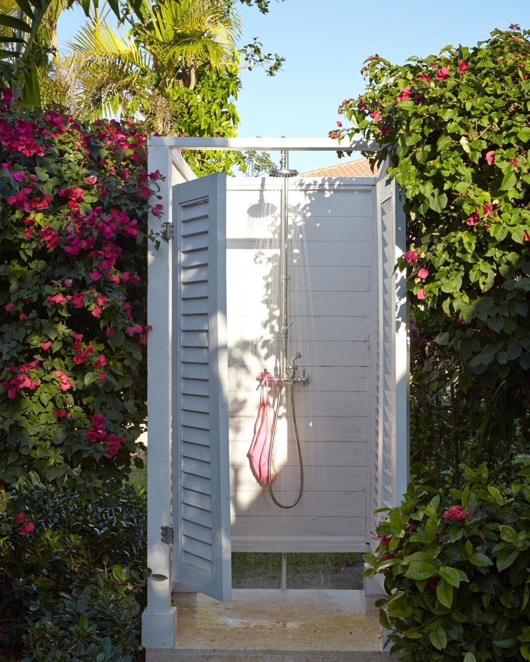 &quot;An outdoor shower comes in handy near the beach. This one is located between the pool and the golf cart shed, a convenient stop for anyone heading toward the house after a swim.&quot; - Amanda quoted from her book, Island Hopping 📔✨🌴⠀⠀⠀⠀⠀⠀⠀⠀⠀