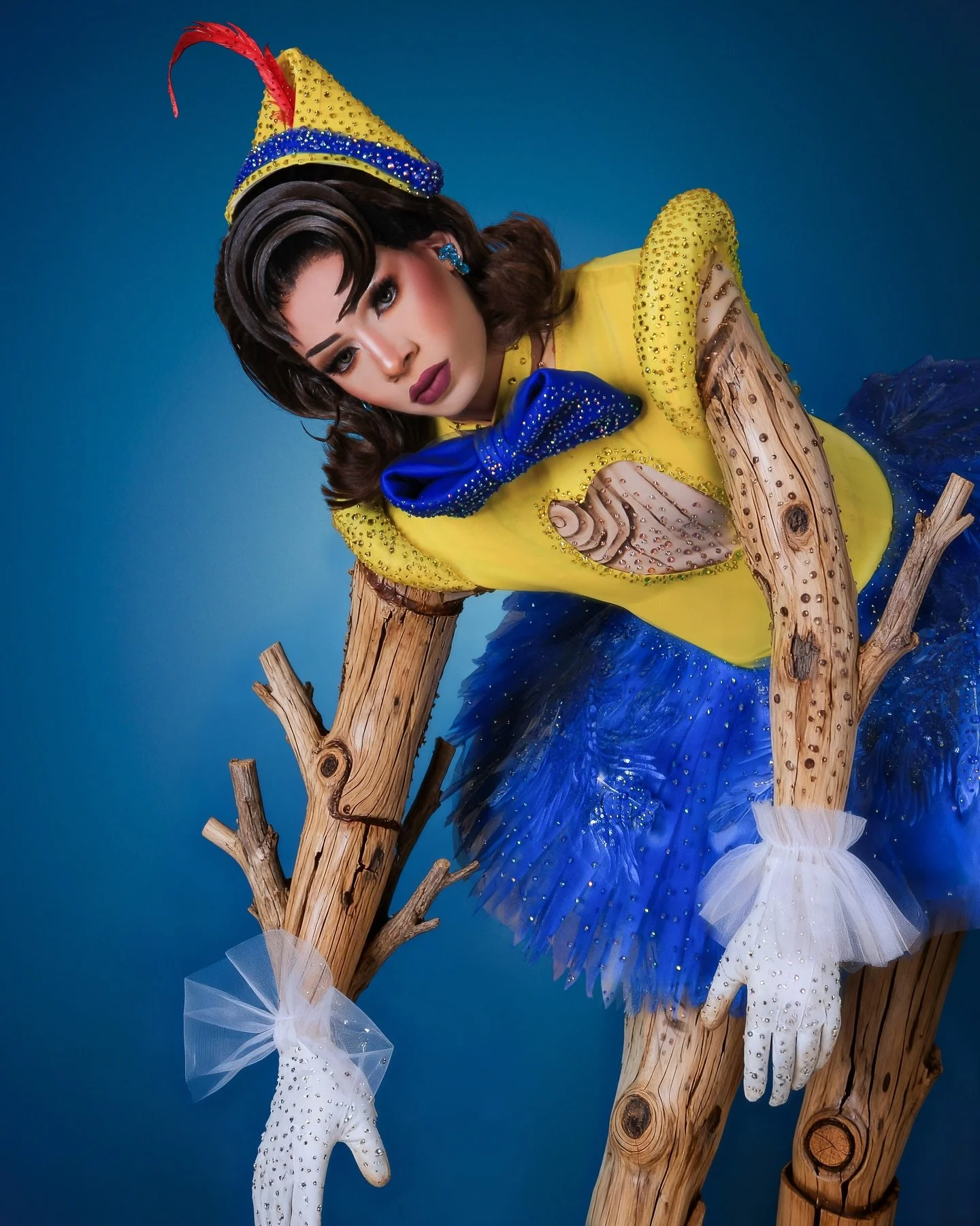 beautiful Latin drag queen dressed in a Pinocchio costume