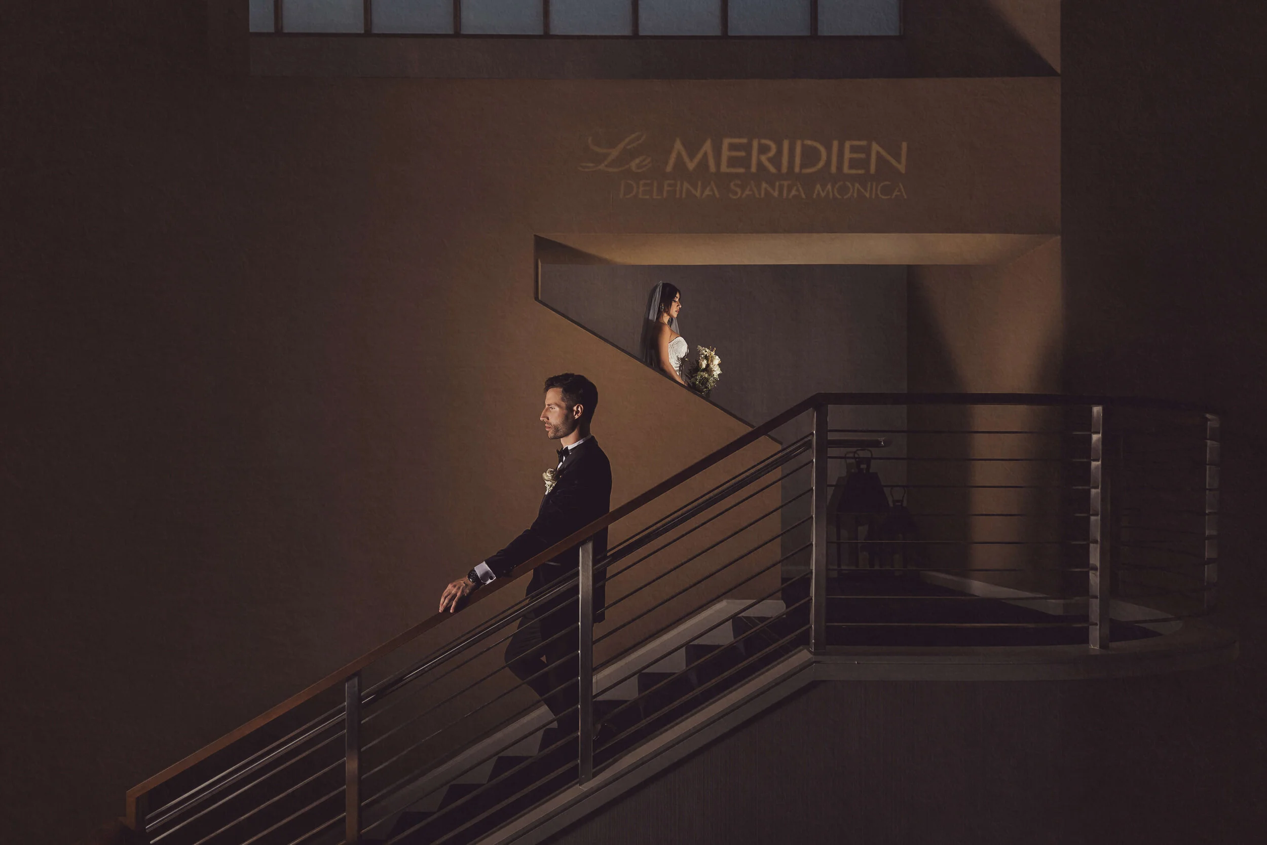 The groom awaits for the bride on the stairwell at The Hyatt Centric Delfina, Santa Monica