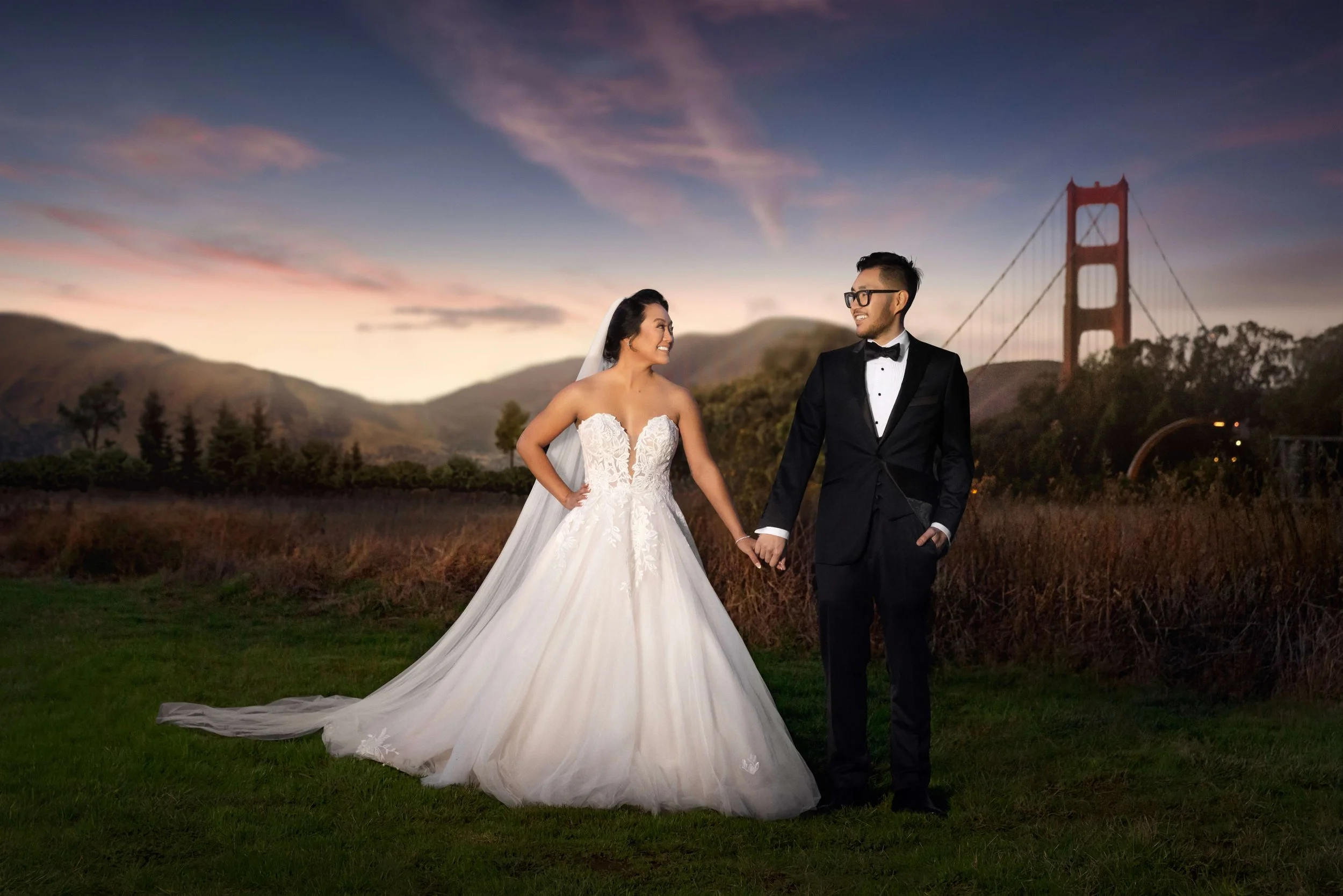 Bride and Groom holding hands near The Golden Gate Bridge in San Francisco, CA