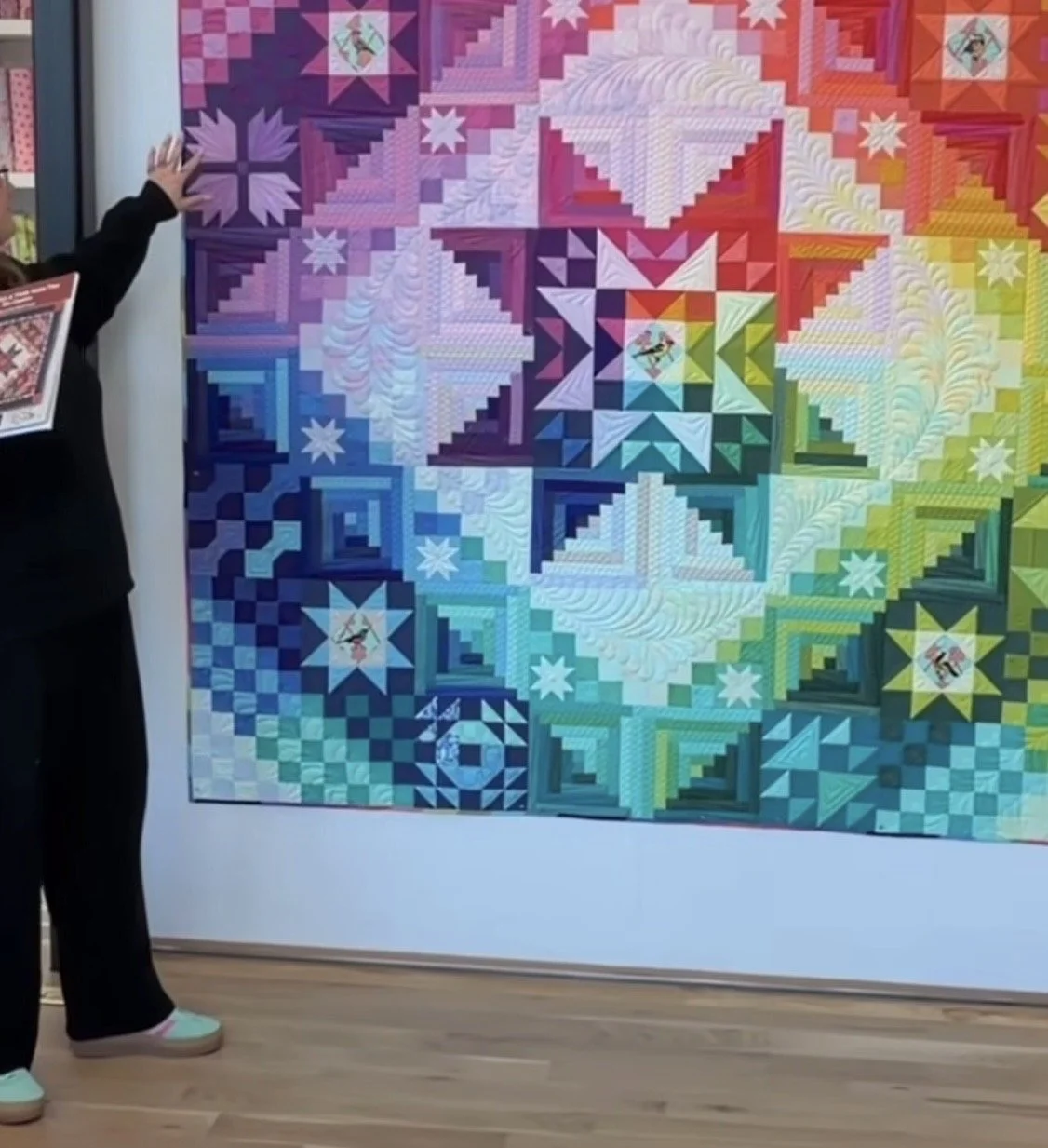 screenshot of Tula Pink introducing rainbow colour way for Amish with a Twist 2.0 quilt.