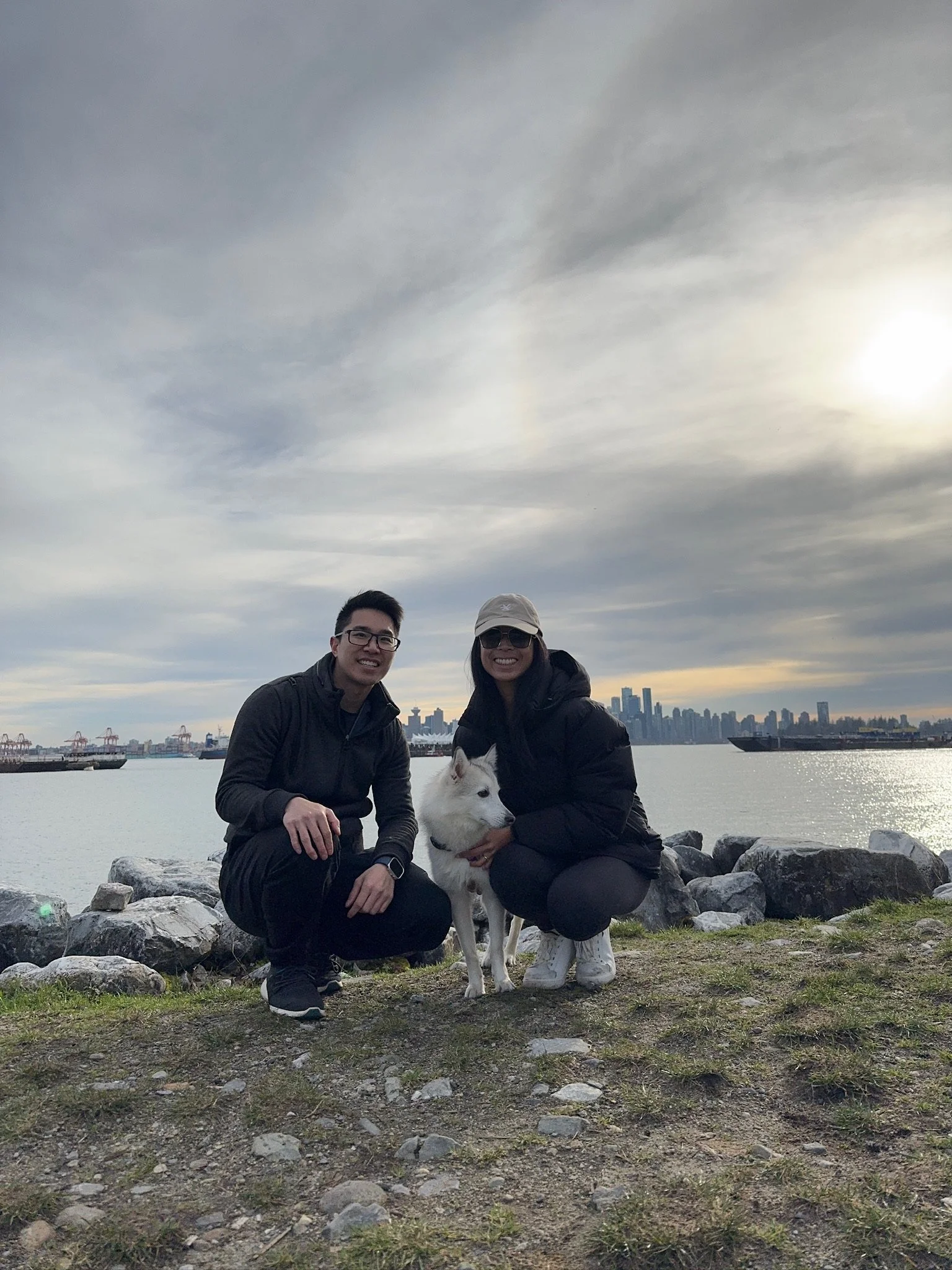 photo of couple with their white dog for testimonial