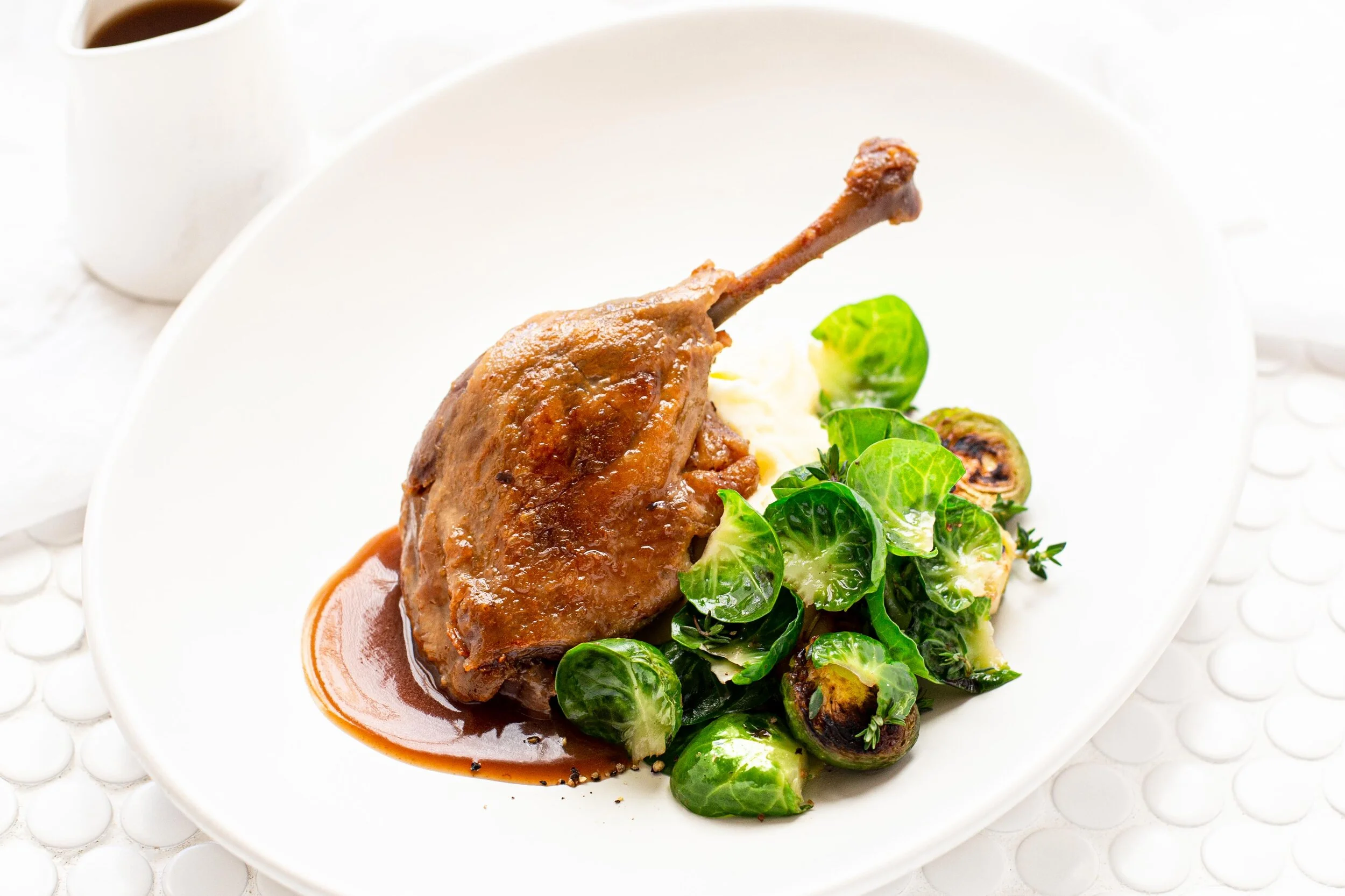 Confit Duck Legs with Garlic Mash & Brussel Sprouts — Angelakis Bros