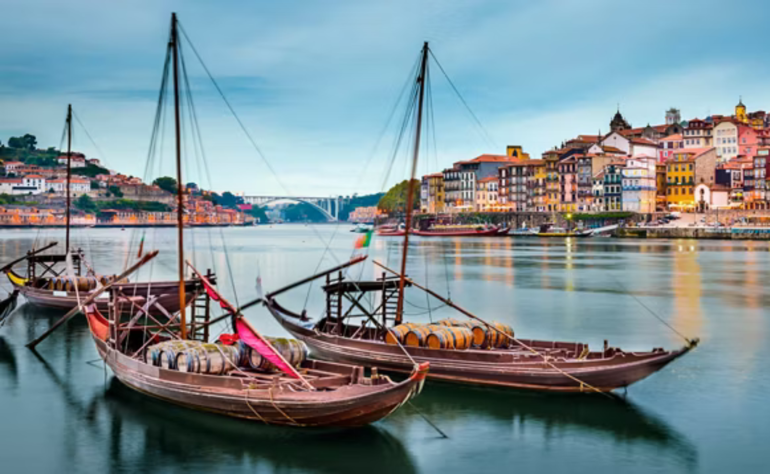 Traditional rabelo boats floating on the Douro River in Porto, Portugal