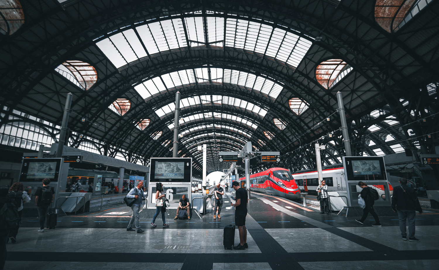 Eurostar train at a large European station connecting London and Paris.