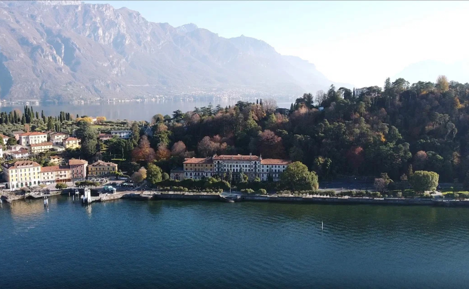 Scenic aerial view of the future Ritz-Carlton Lake Como overlooking the lake, mountains, and historic waterfront villas in Bellagio.