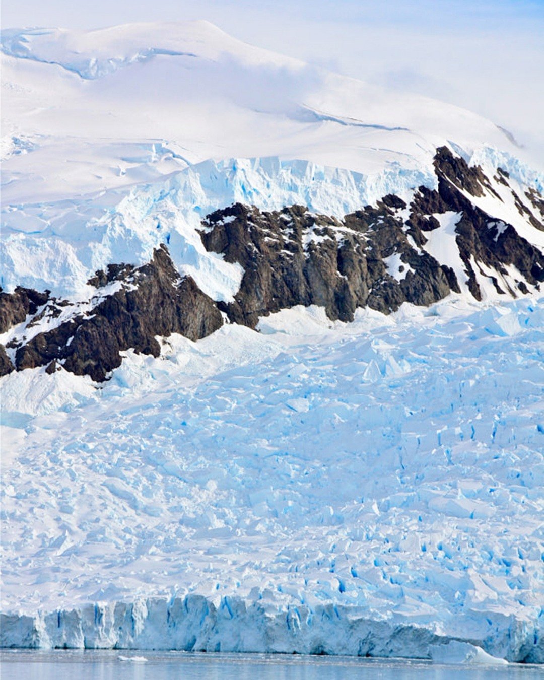 Antarctica isn&rsquo;t just a destination. It&rsquo;s an experience that makes you feel very small in the best possible way.⁣
⁣
Imagine sailing through icy waters surrounded by towering glaciers, watching penguins waddle along the shoreline, spotting