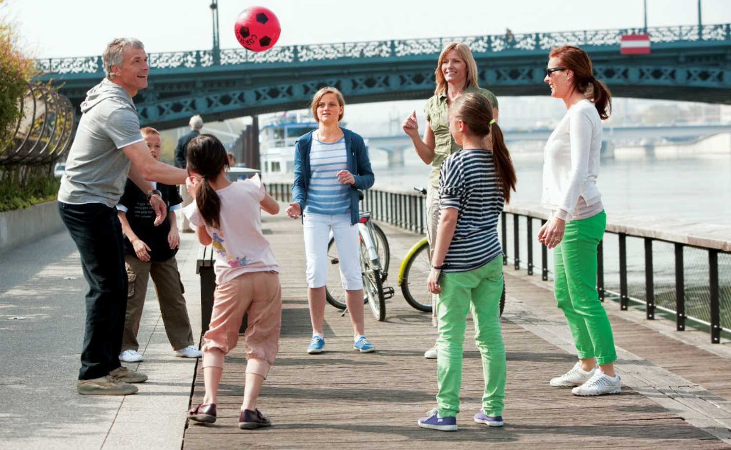 Multigenerational family enjoying free time together along a European river during a river cruise excursion