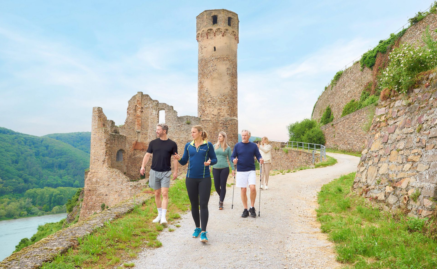 Small group exploring a medieval castle during an included European river cruise excursion