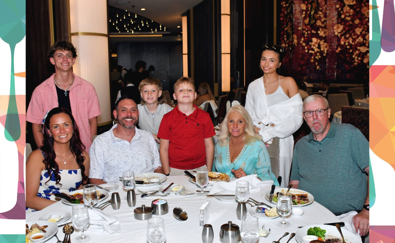 A large multi-generational family enjoying dinner together aboard a cruise ship, featuring grandparents, parents, teens, and children gathered around the table.