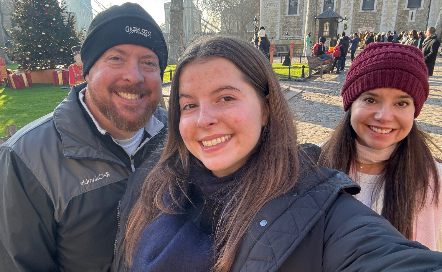 Family visiting a historic site in London on a sunny winter afternoon.