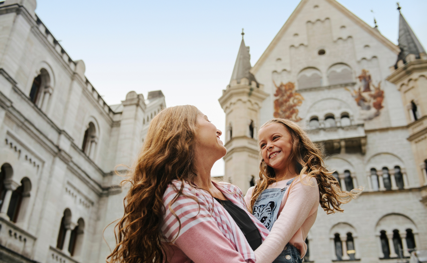 Mother and daughter visiting Neuschwanstein Castle in Germany on an Adventures by Disney vacation.