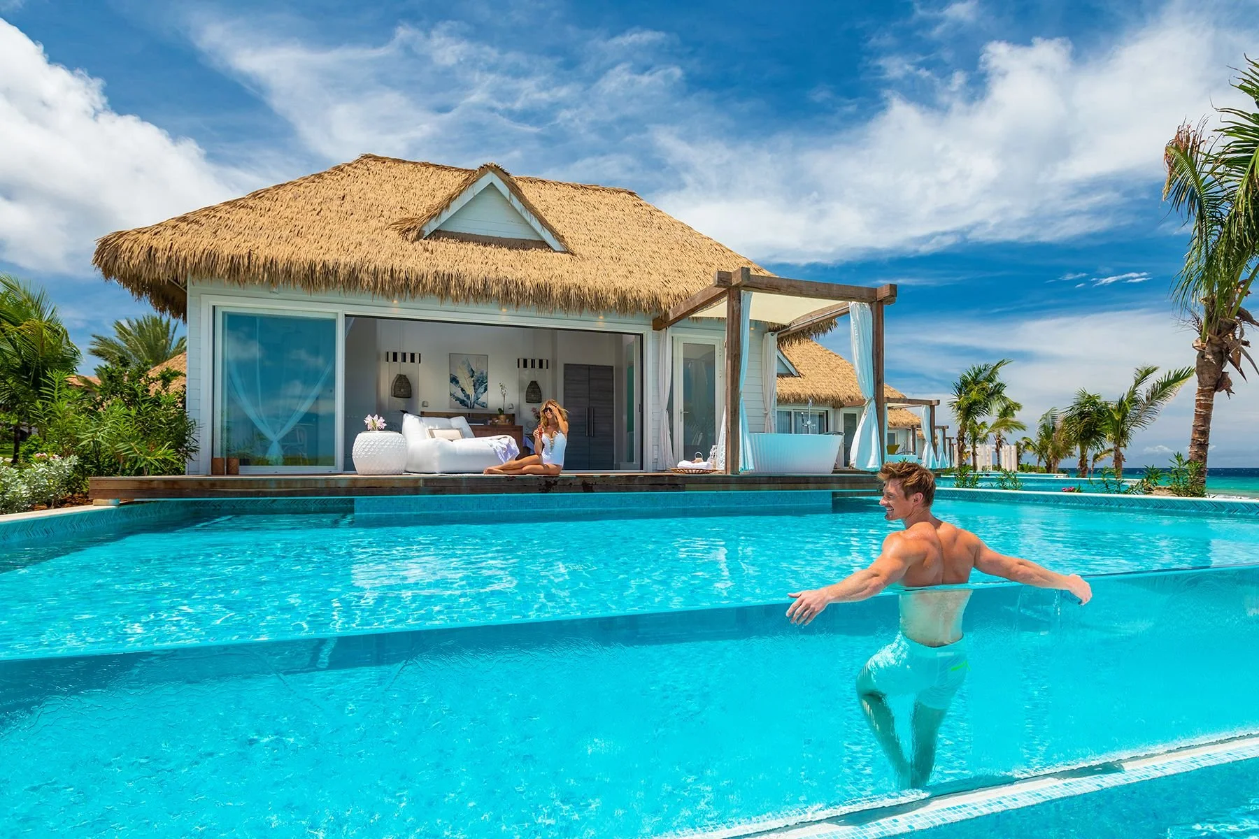 A modern oceanfront suite with a private pool overlooking the turquoise waters of Curaçao.