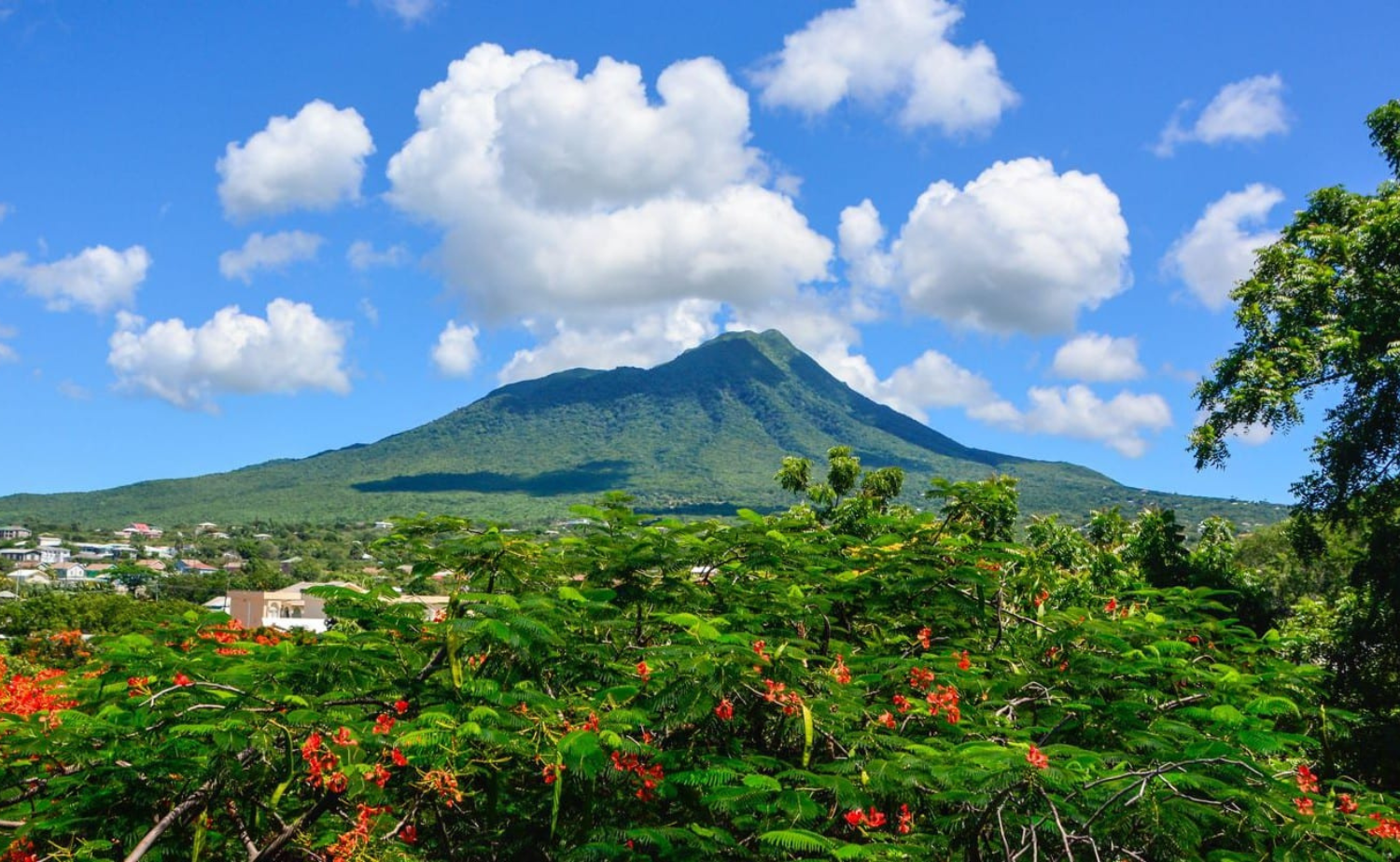 Nevis Peak rising above the lush tropical landscape of Nevis in the Caribbean.