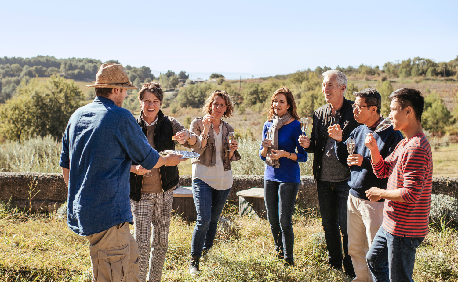 Adult travelers enjoying a food and drink experience during a guided vacation.