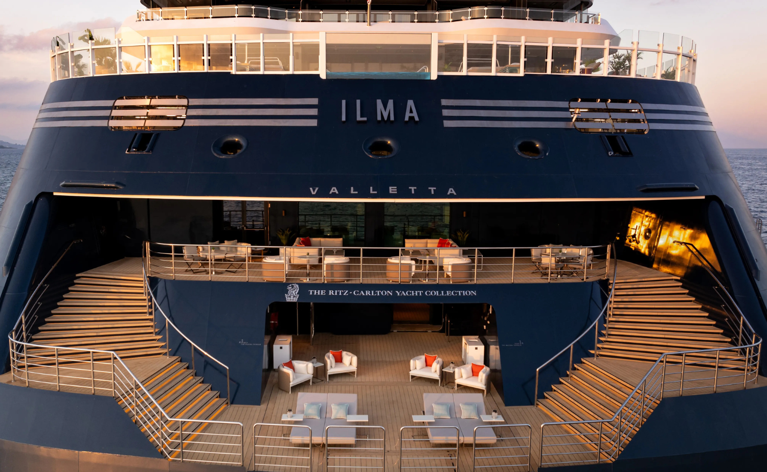 The Ritz-Carlton Yacht Collection’s Ilma viewed from the stern at sunset