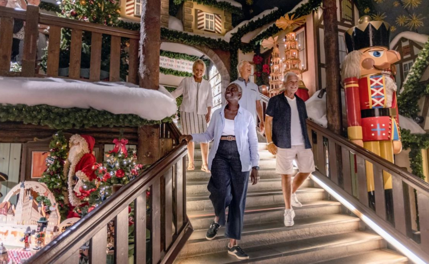 Travelers exploring a festive European Christmas market during a holiday river cruise