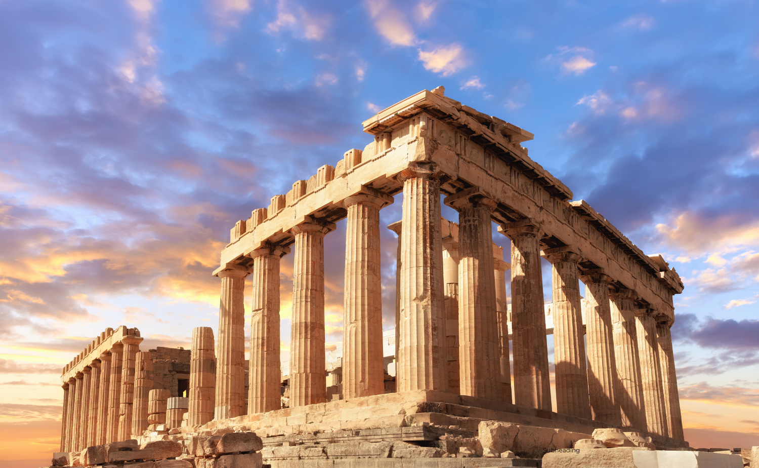 Close-up of the Parthenon on the Acropolis, with dramatic evening sky and golden sunlight highlighting the columns.