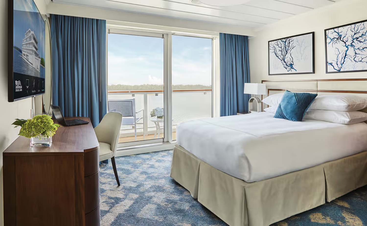 Spacious balcony stateroom aboard a luxury European river cruise ship
