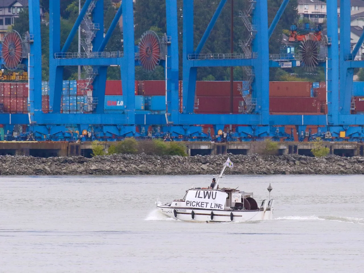  ILWU picket line boat near Fraser Surrey Docks, Fraser River, Surrey, B.C., July 10, 2023. 