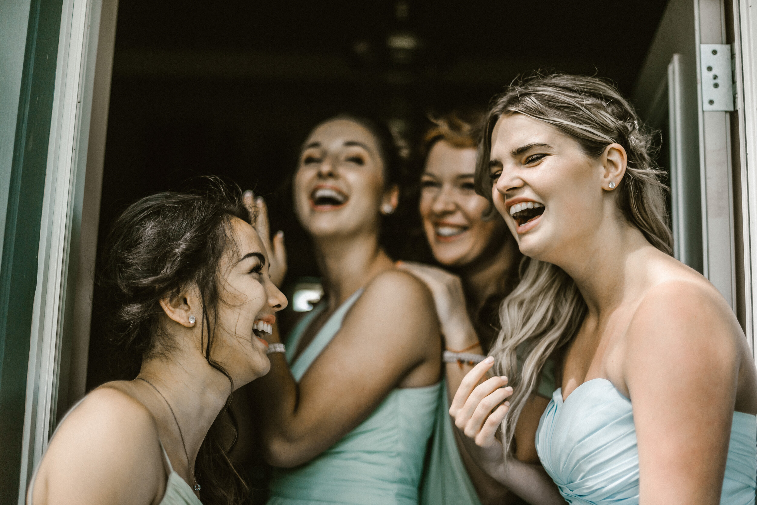 Laughing wedding guests