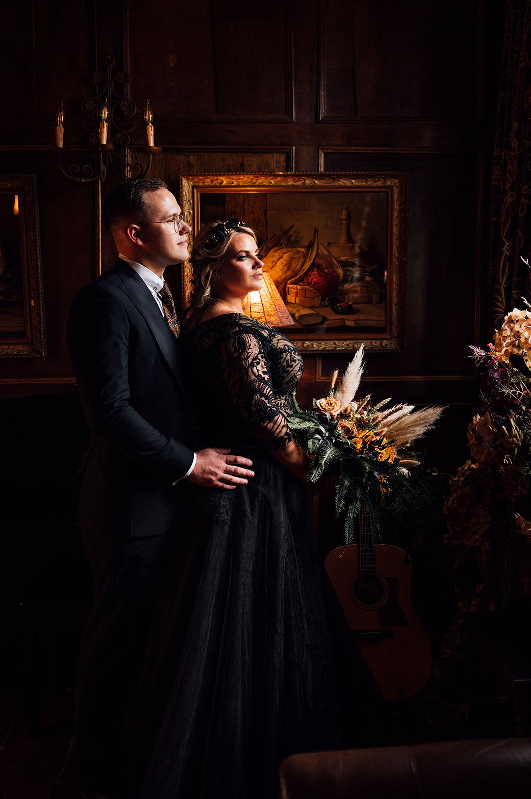 a bride and groom dramatically lit in a halloween themed wedding