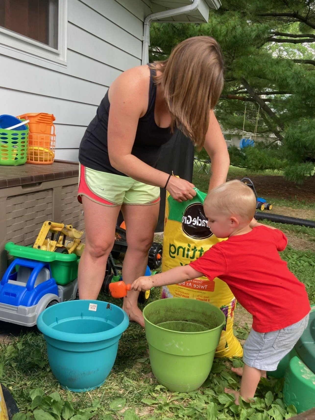 Mom+and+son+planting+at+home.jpg