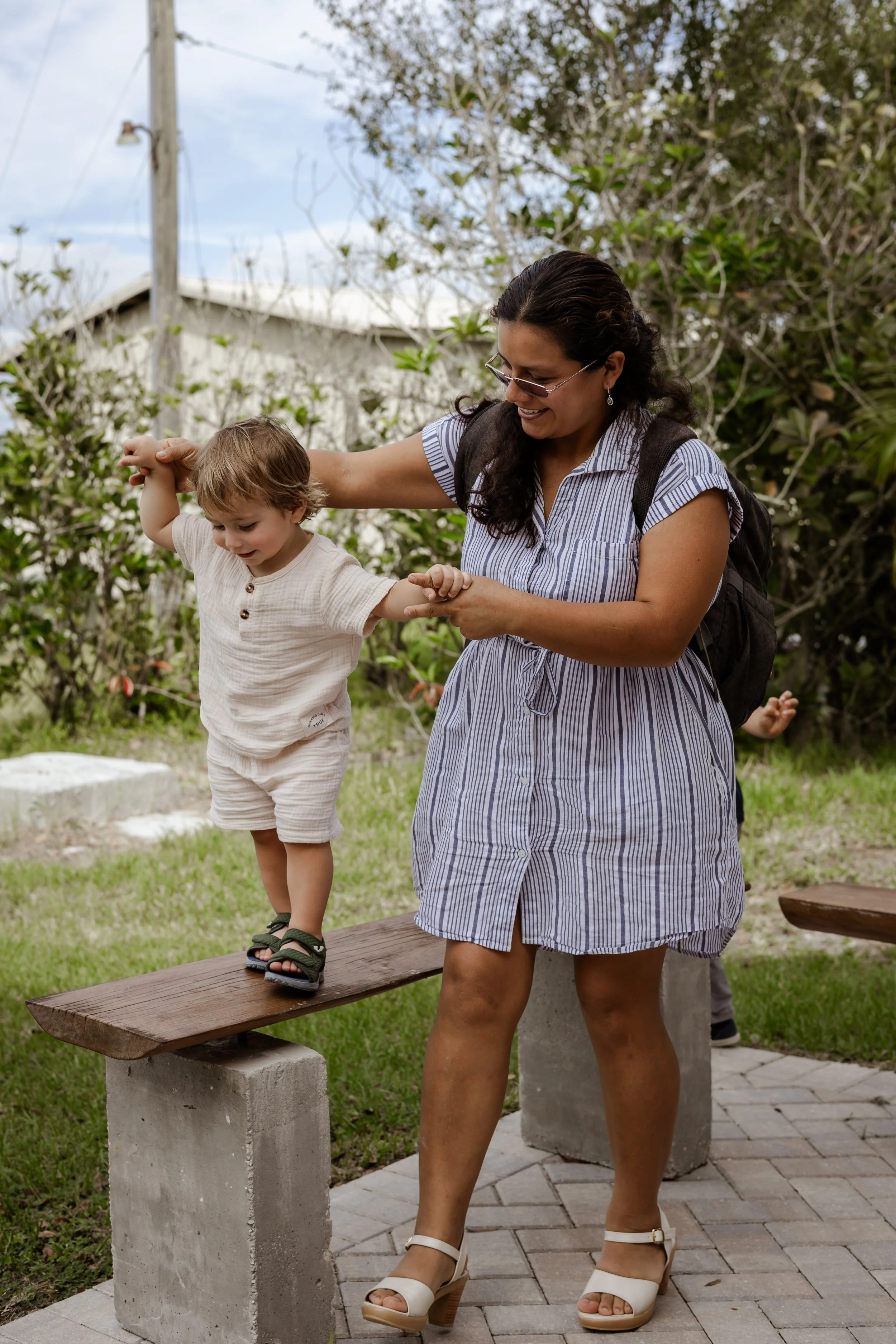 Caty and Luca walking on bench.jpeg