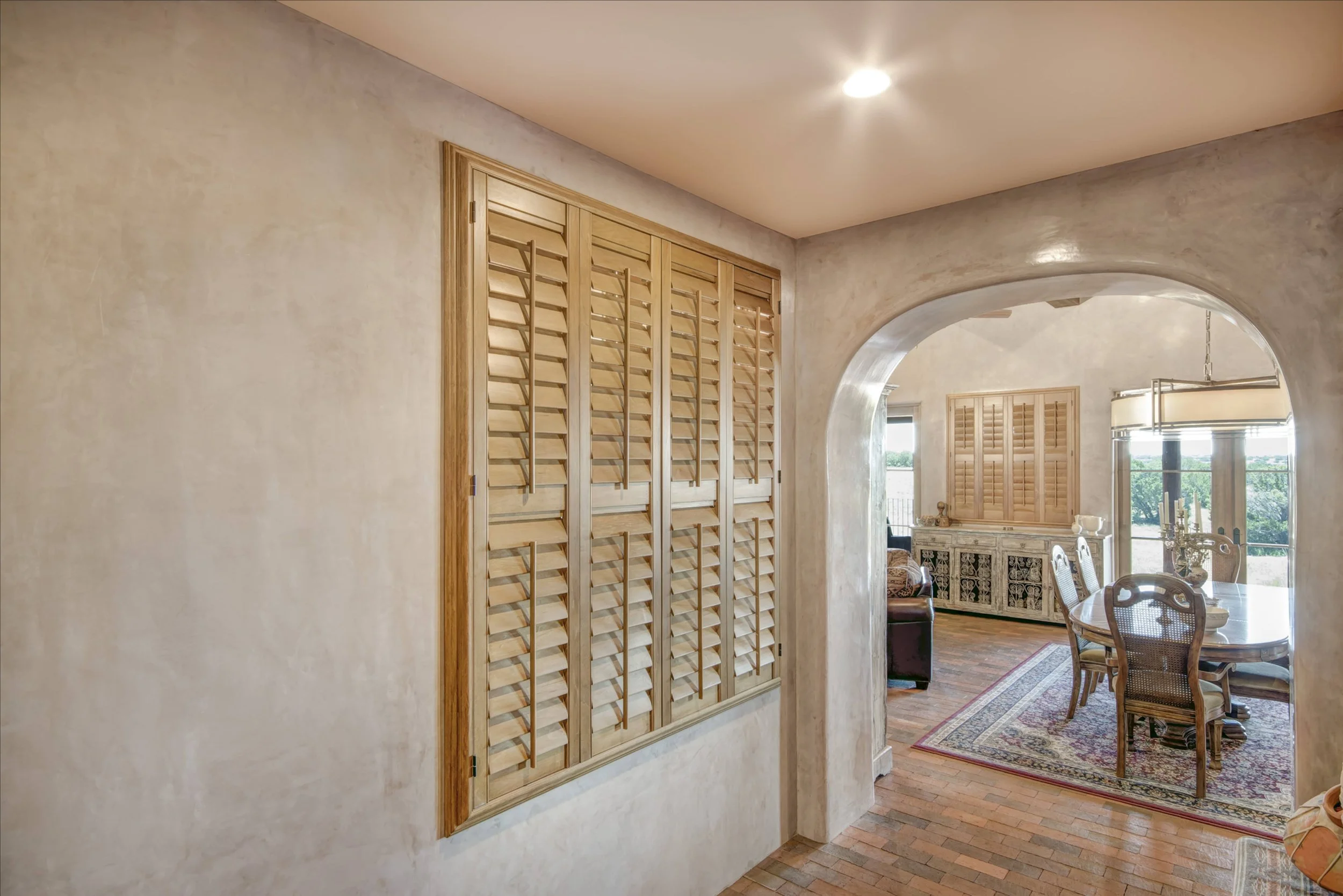 Close view of Sands-stained hardwood shutter panels and natural wood grain in a Santa Fe interior.