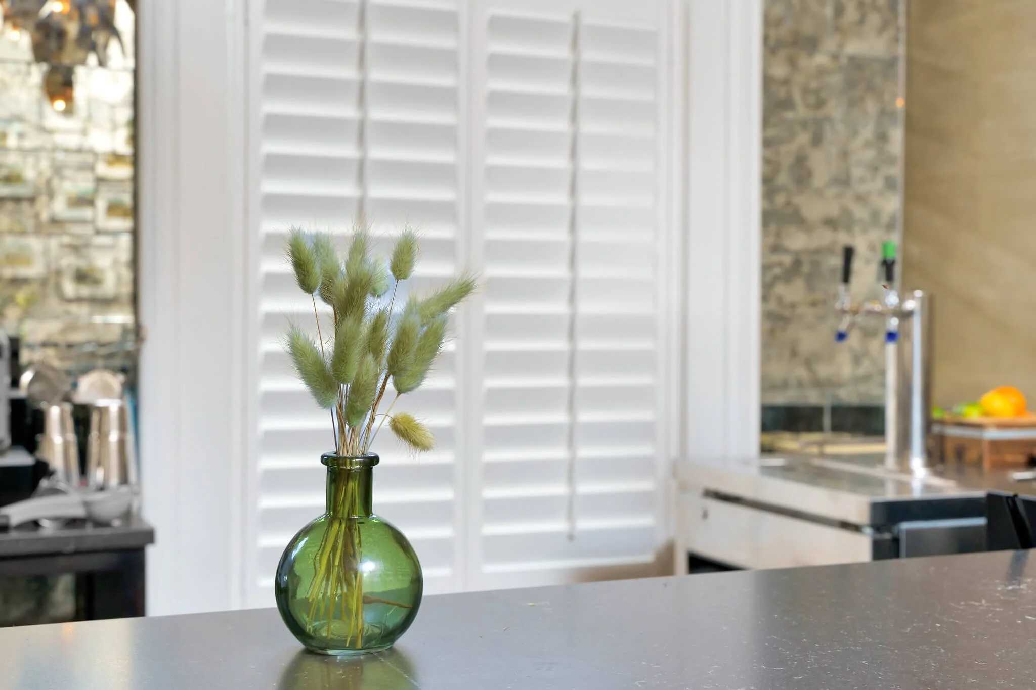White LiteLine shutters behind the bar at Limewater Bistro in Frankfort, Kentucky.