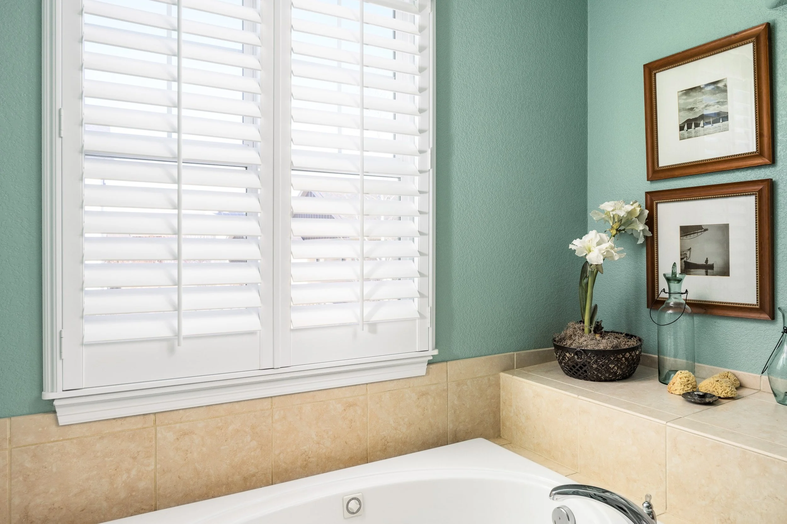 Bright white plantation shutters over tubin the Colorado Classic home.
