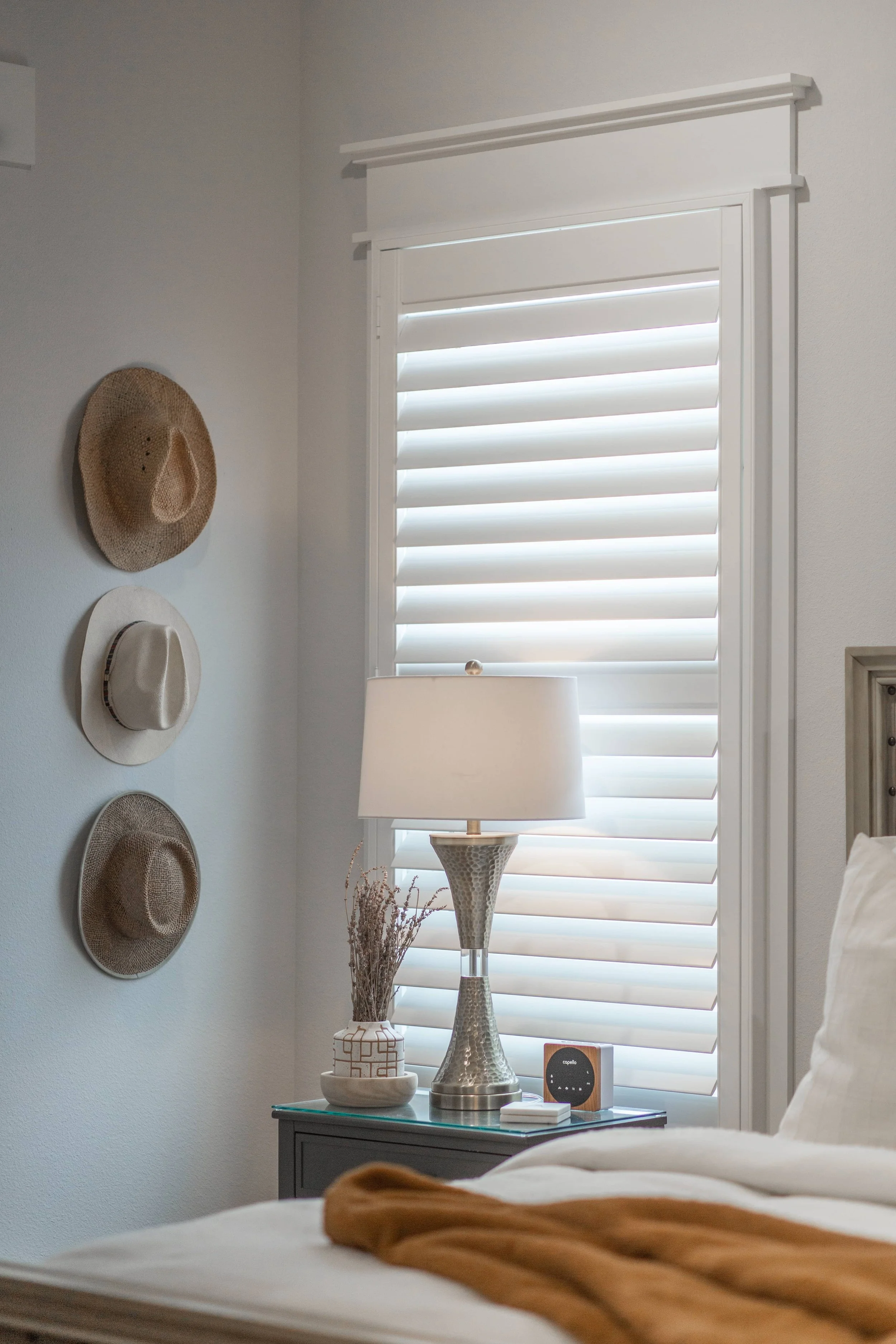 Bright white ClearLine shutter with Craftsman frame and 3.5-inch louvers in a Northwest Arkansas bedroom.
