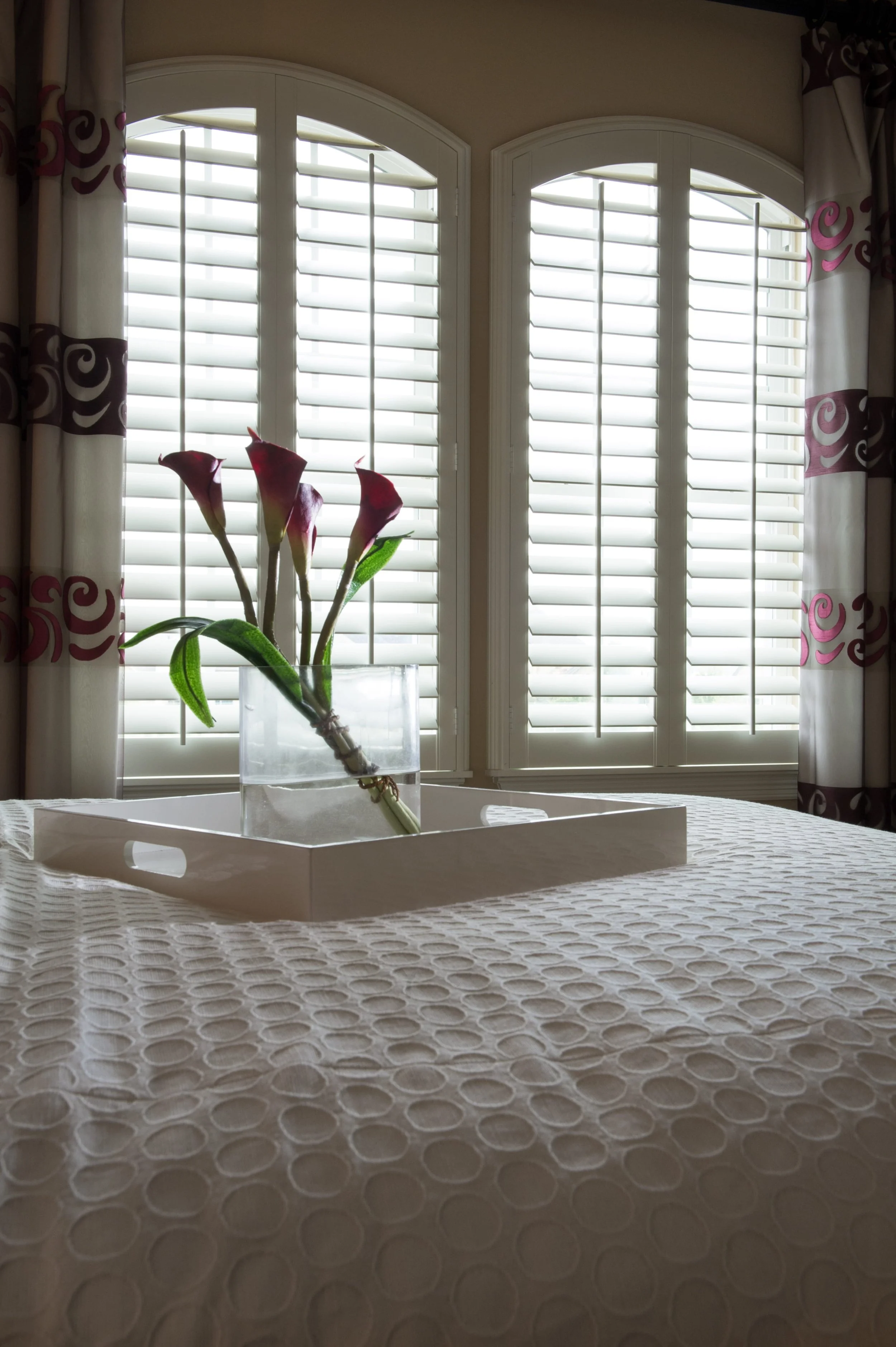 Rockwood Shutters shutters on arched windows in Sugarland, Texas home.