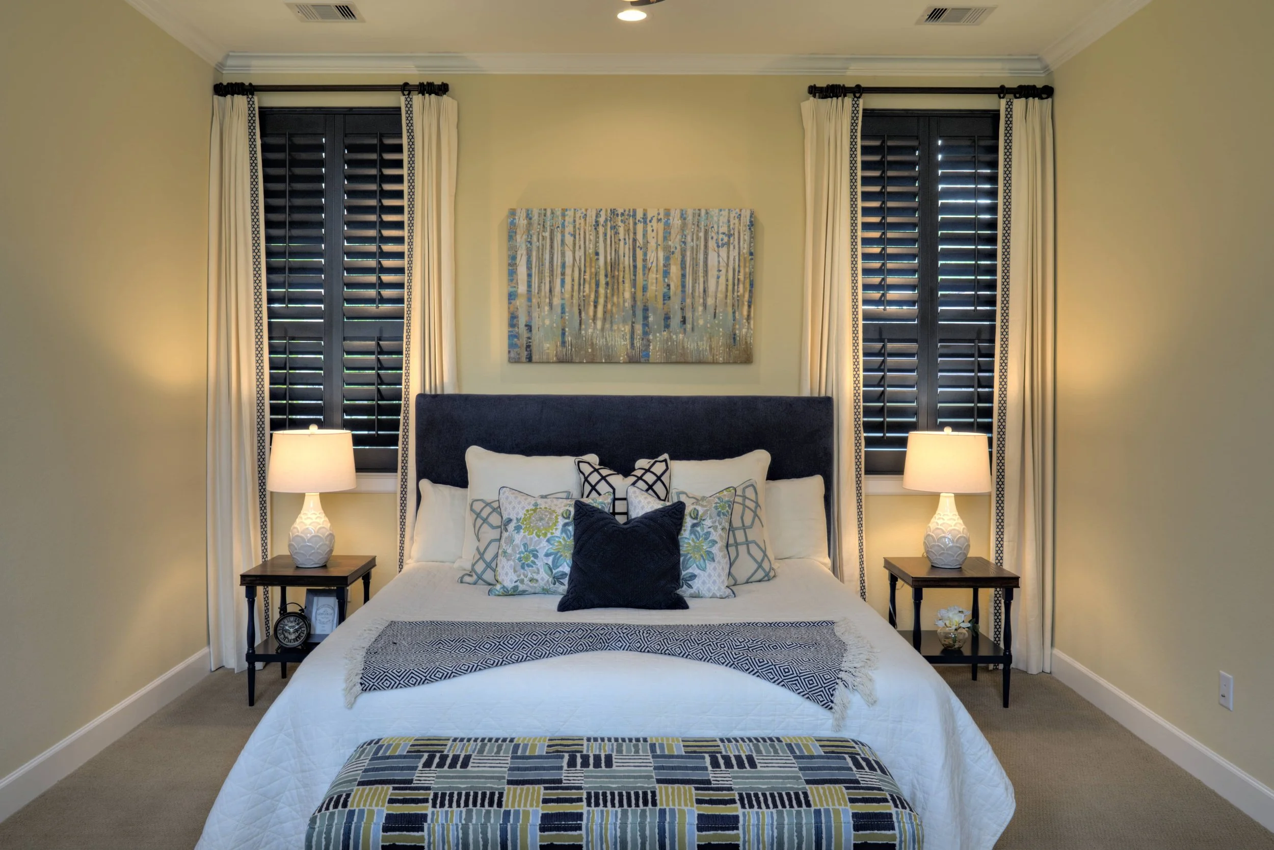 Wigton_0176.jpgDark stained plantation shutters with classic tilt rods framing a bedroom in a Houston, Texas home.