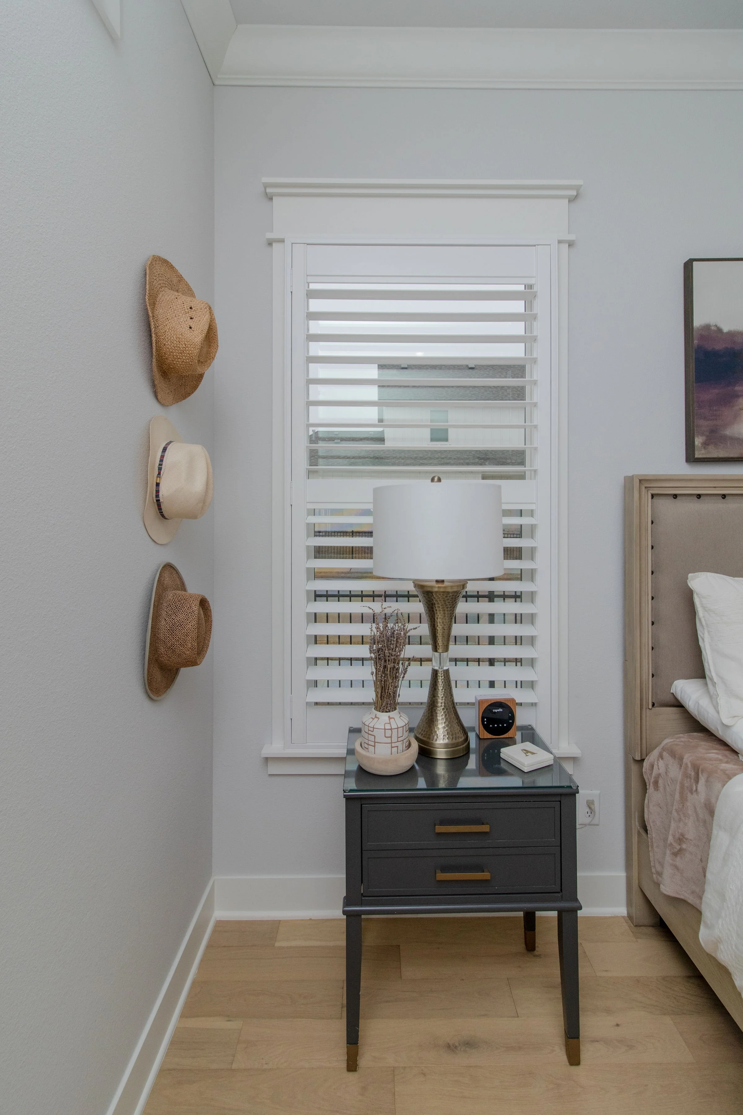Bright white ClearLine plantation shutter with 3.5-inch louvers in a Northwest Arkansas bedroom.