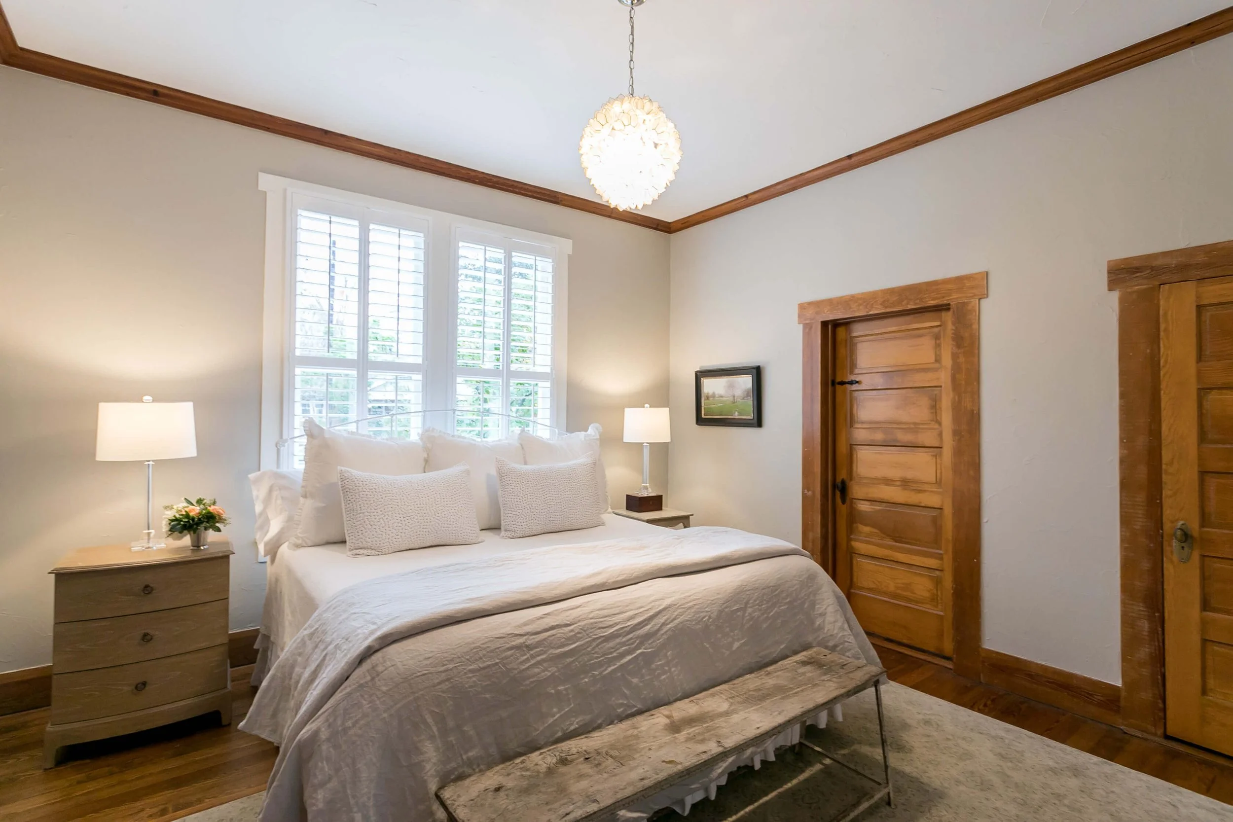 Rockwood white plantation shutters bringing natural light into a Bella Regalo bedroom in Fredericksburg, Texas