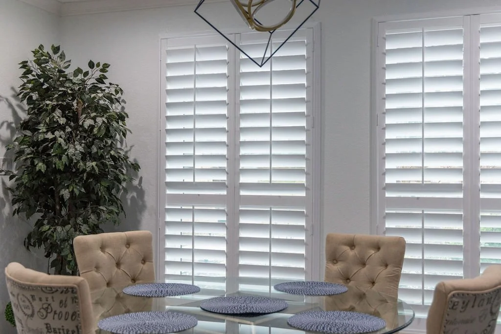 Close up photo of white plantation shutters from Rockwood in Dallas urban home.