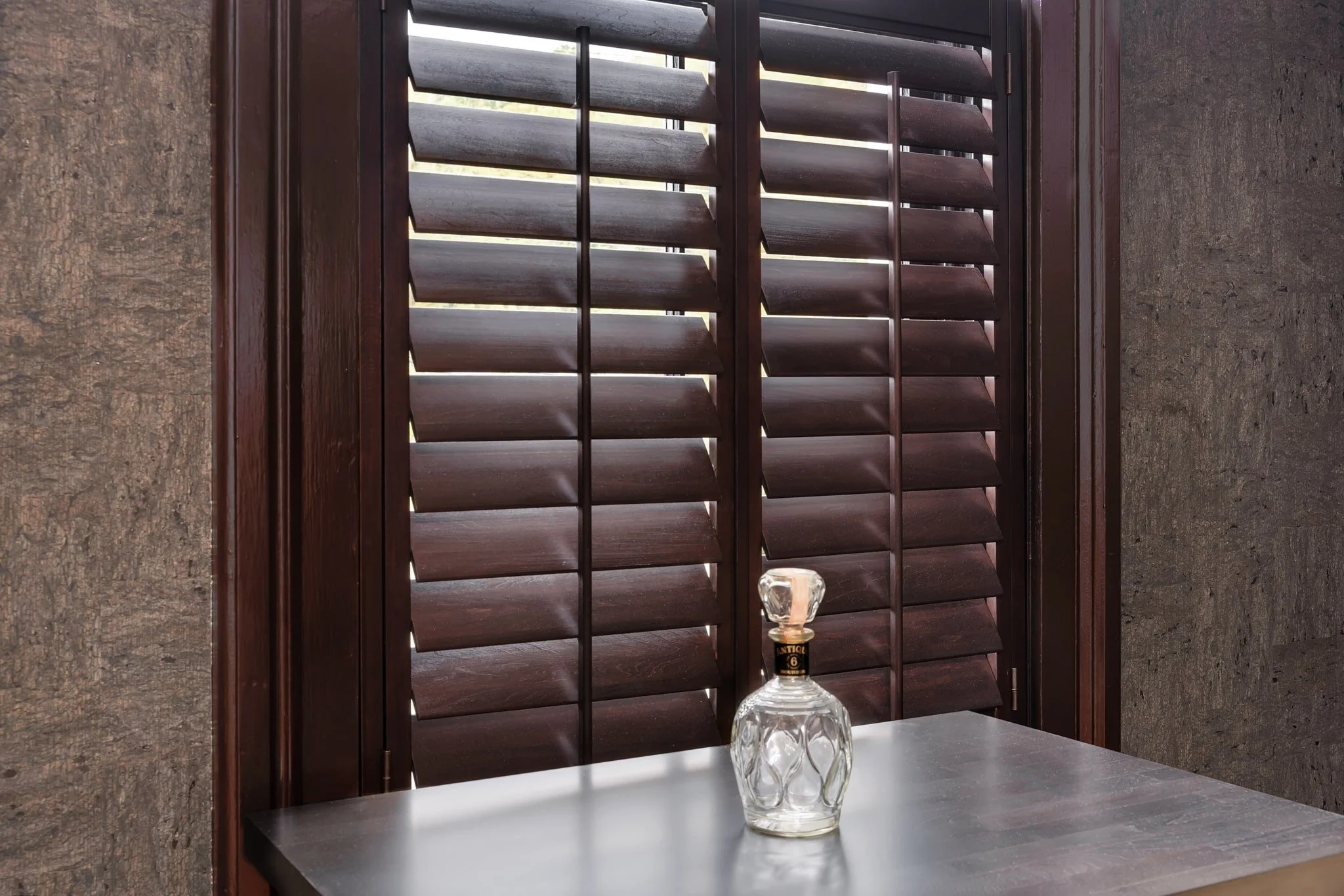 Close-up of dark wood café-style shutters at Limewater Bistro in Frankfort, Kentucky.