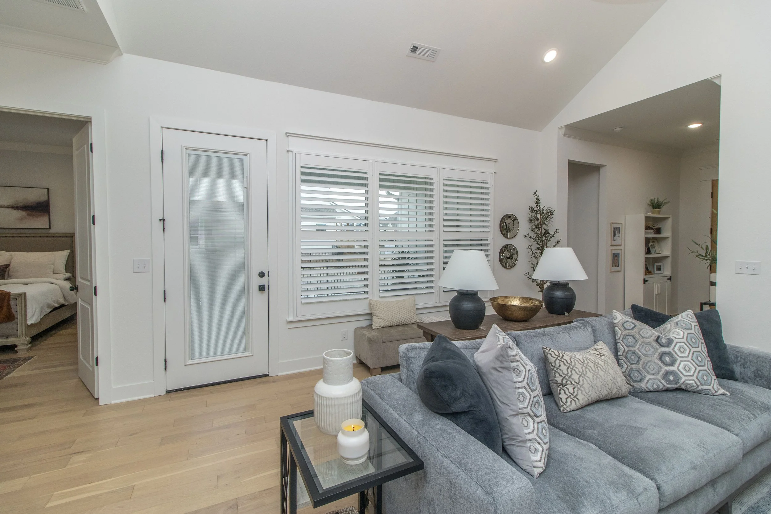 Northwest Arkansas living room featuring bright white Craftsman frame shutters with ClearLine tilt.