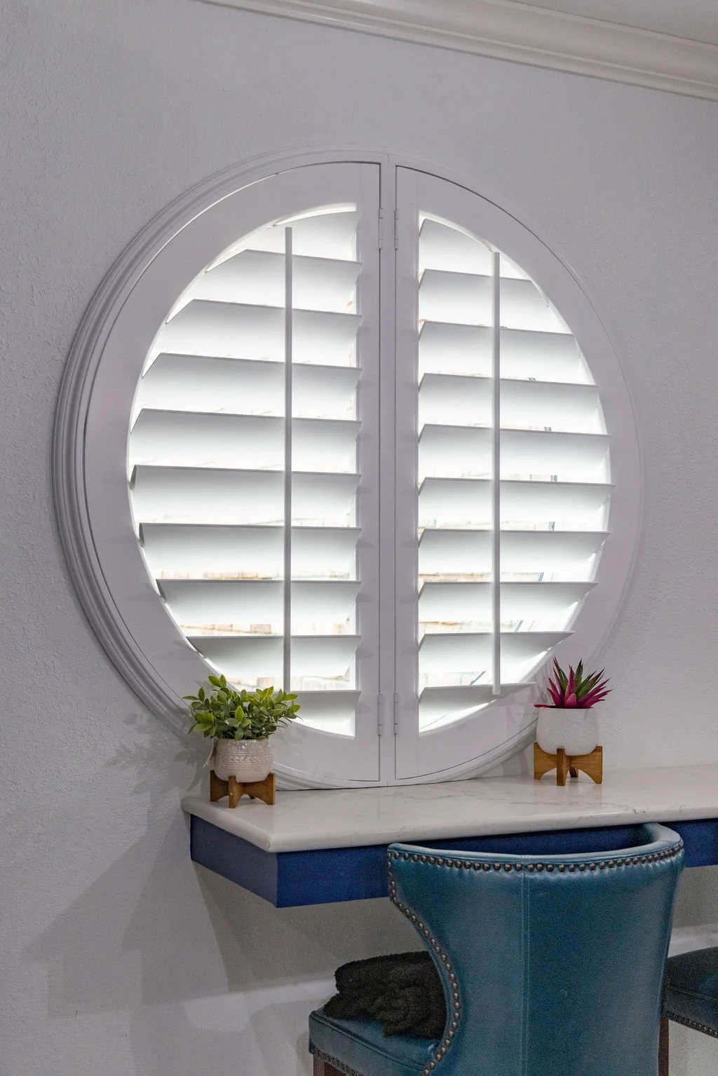 Rockwood custom shutters on a round window in an Urban Dallas home. 