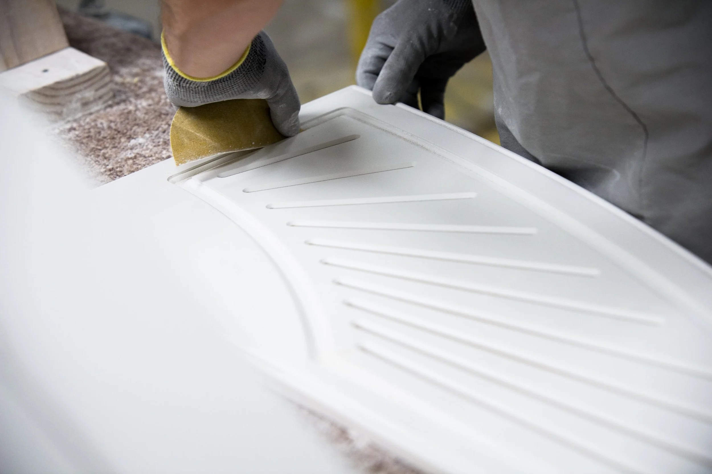 Photo of a shutter being finished in the Rockwood Shutters manufacturing facility.