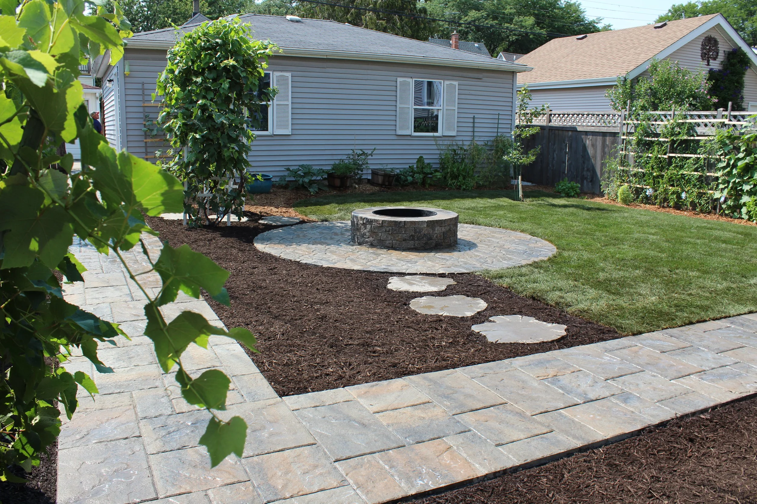 Our projects focus on executing quality hardscape and landscapes, including patios, outdoor fire pits, grilling areas, set walls, landscape lighting, pergolas, and drainage solutions.  We also offer full-service maintenance packages to keep your land