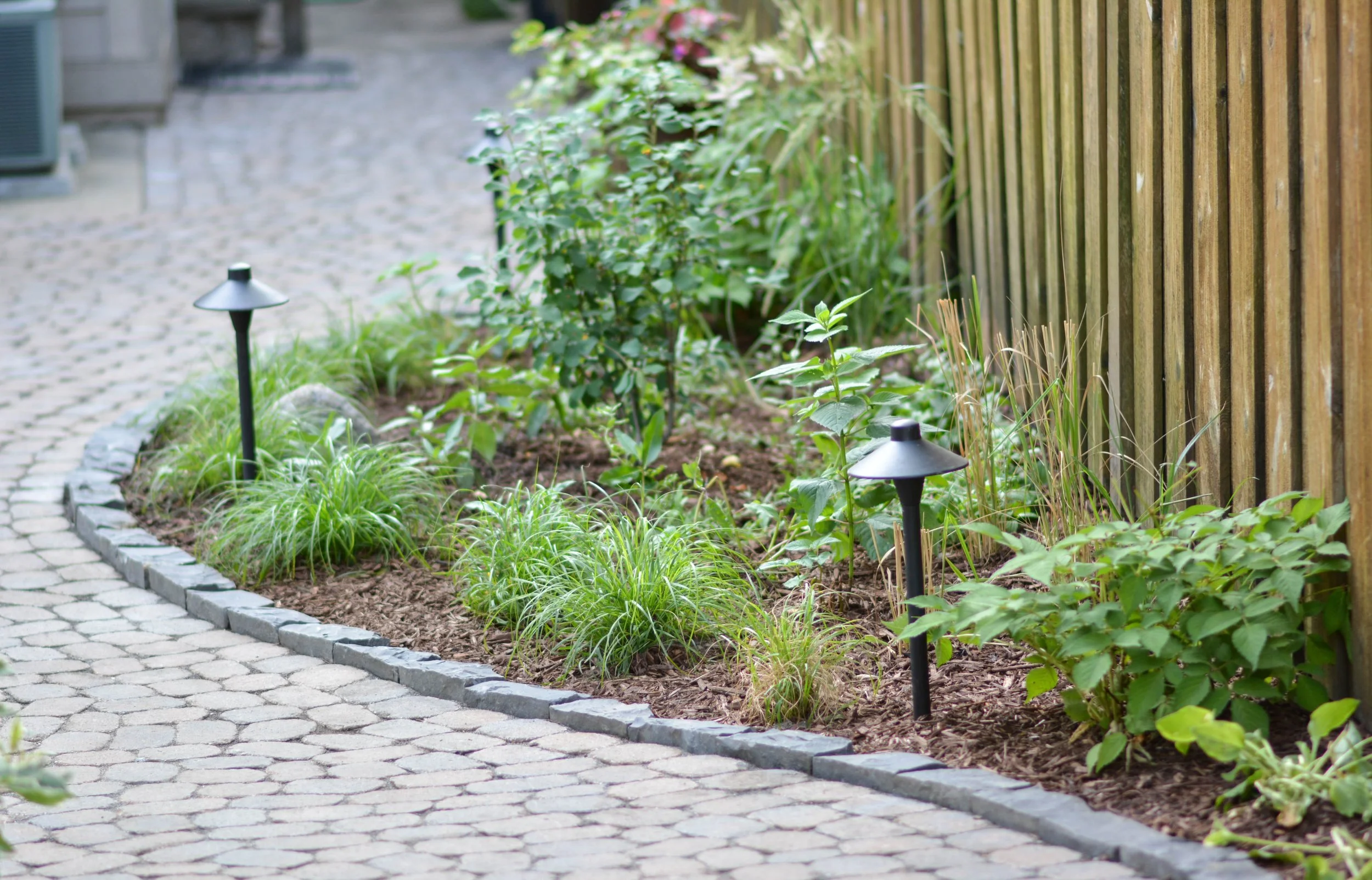 Our projects focus on executing quality hardscape and landscapes, including patios, outdoor fire pits, grilling areas, set walls, landscape lighting, pergolas, and drainage solutions.  We also offer full-service maintenance packages to keep your land