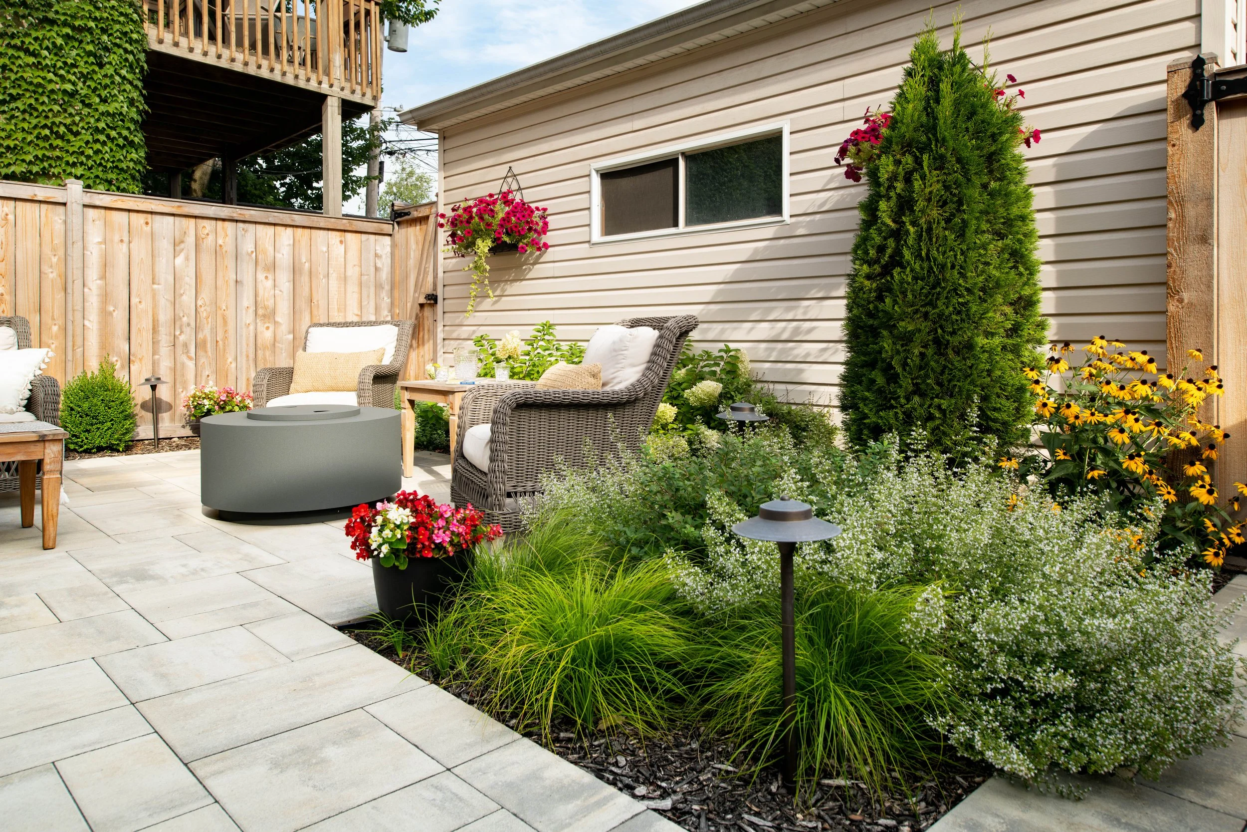 We provide a range of landscape services including Hardscapes, Outdoor Kitchens, Pergolas, Seat Walls, Fire Pits, Lawns, Landscape Lighting, Water Features, Custom Screening, Planting, Drainage Solutions, Holiday Lighting, and much more.  