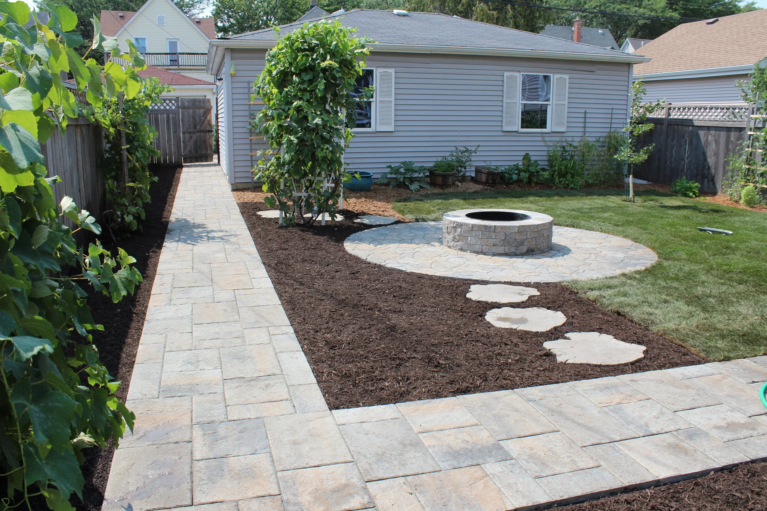 Our projects focus on executing quality hardscape and landscapes, including patios, outdoor fire pits, grilling areas, set walls, landscape lighting, pergolas, and drainage solutions.  We also offer full-service maintenance packages to keep your land