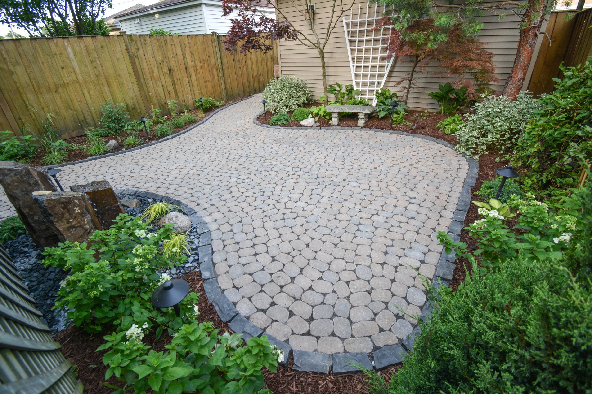 Our projects focus on executing quality hardscape and landscapes, including patios, outdoor fire pits, grilling areas, set walls, landscape lighting, pergolas, and drainage solutions.  We also offer full-service maintenance packages to keep your land