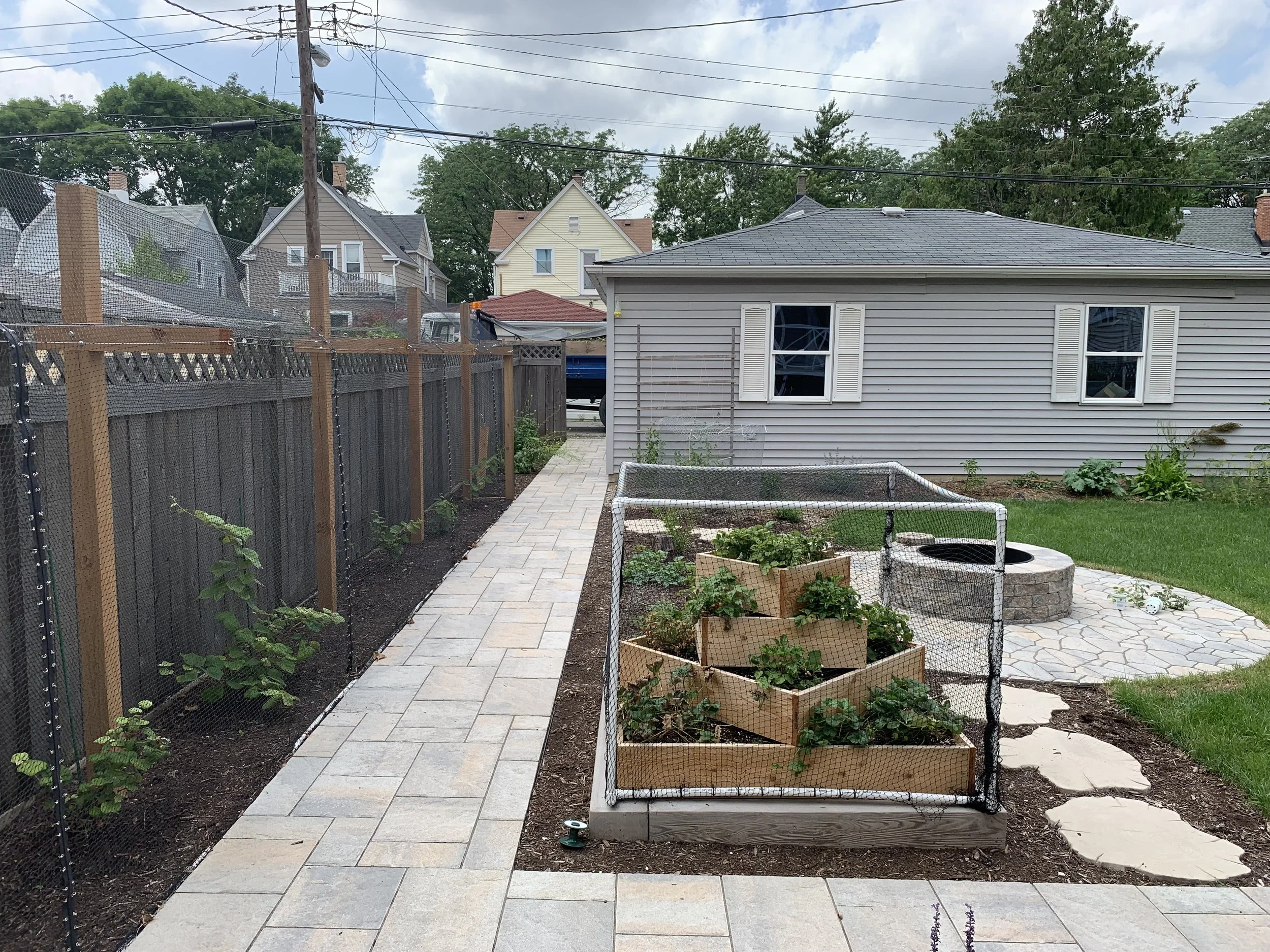 We provide a range of landscape services including Hardscapes, Outdoor Kitchens, Pergolas, Seat Walls, Fire Pits, Lawns, Landscape Lighting, Water Features, Custom Screening, Planting, Drainage Solutions, Holiday Lighting, and much more.