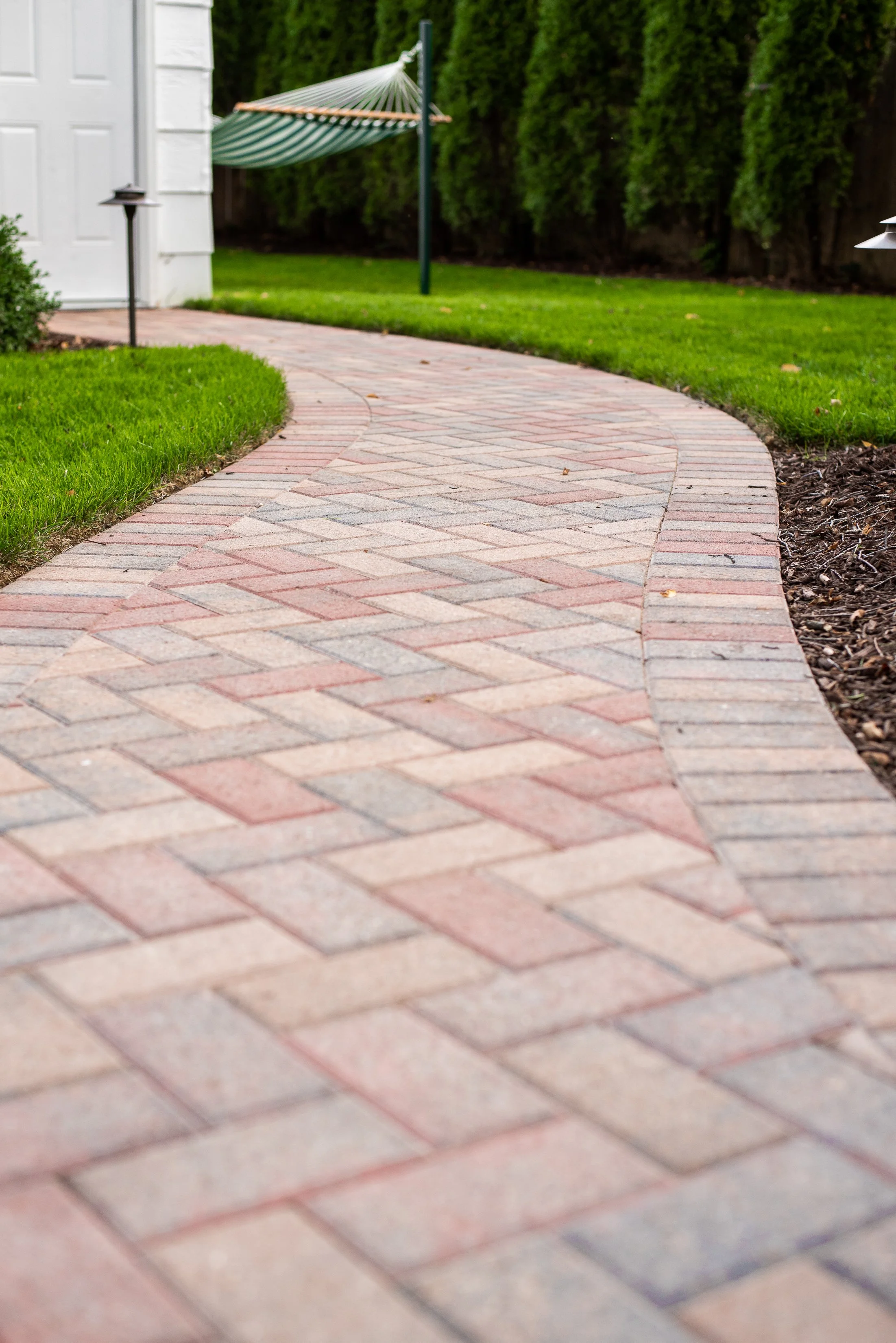 Our projects focus on executing quality hardscape and landscapes, including patios, outdoor fire pits, grilling areas, set walls, landscape lighting, pergolas, and drainage solutions.  We also offer full-service maintenance packages to keep your land