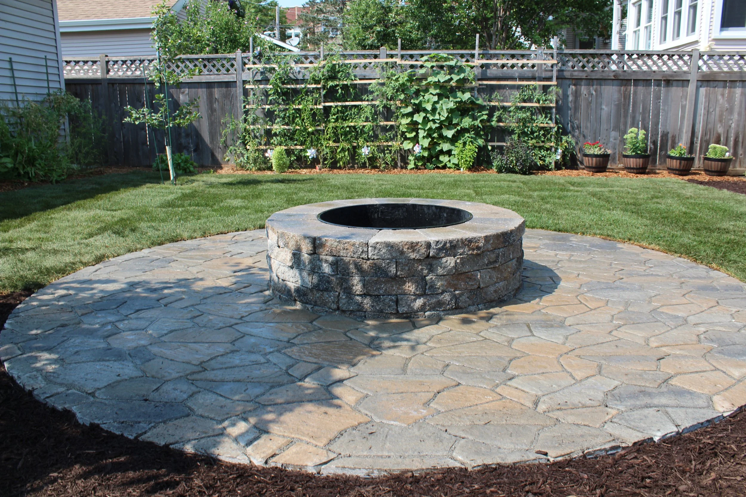 Our projects focus on executing quality hardscape and landscapes, including patios, outdoor fire pits, grilling areas, set walls, landscape lighting, pergolas, and drainage solutions.  We also offer full-service maintenance packages to keep your land