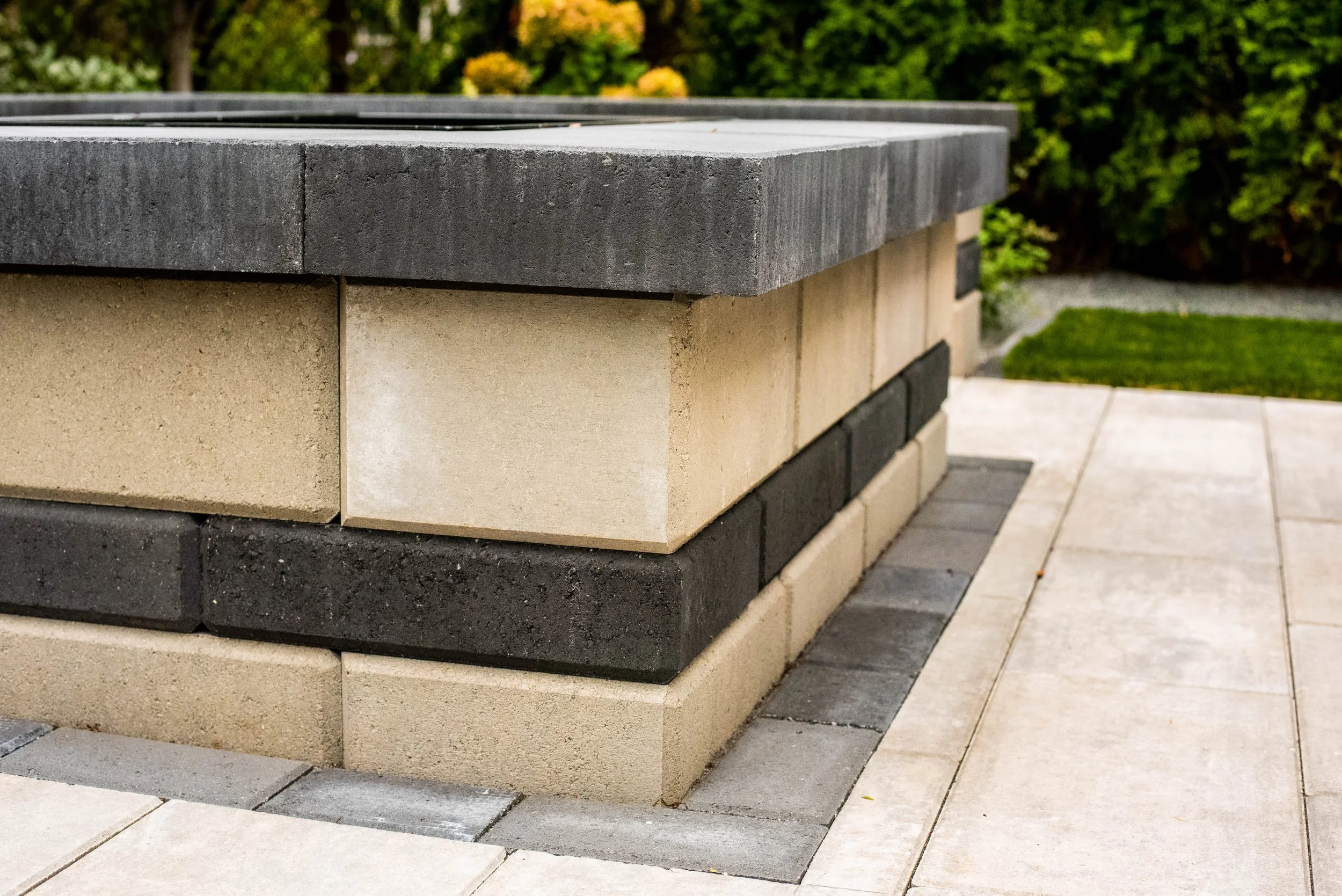 We provide a range of landscape services including Hardscapes, Outdoor Kitchens, Pergolas, Seat Walls, Fire Pits, Lawns, Landscape Lighting, Water Features, Custom Screening, Planting, Drainage Solutions, Holiday Lighting, and much more.  